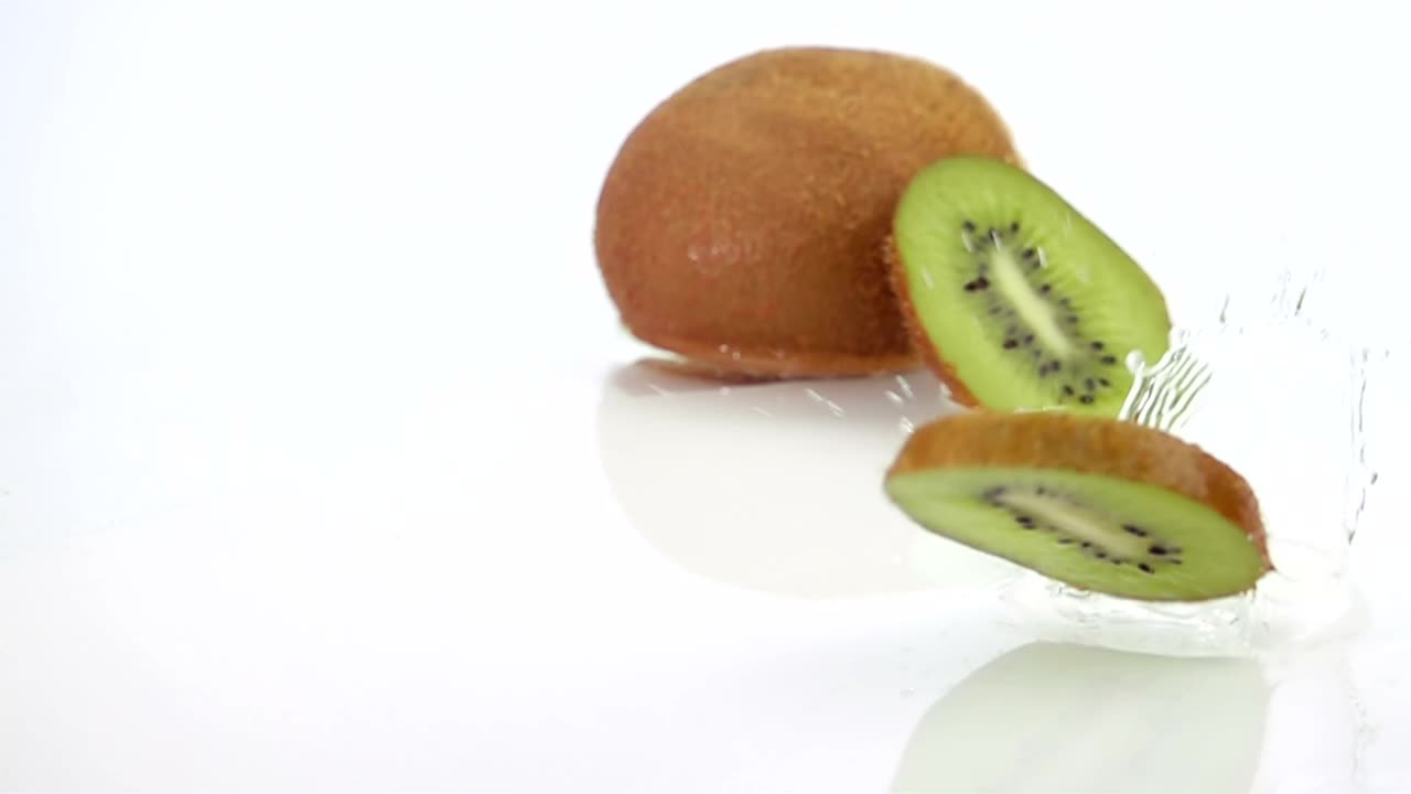 Free Video Stock Slices Of Kiwi Falling Over Water Live Wallpaper