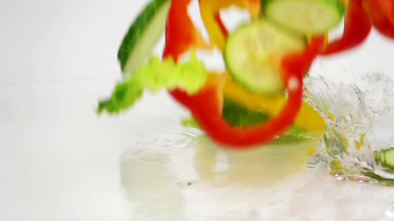 Free Video Stock Slices Of Vegetables Falling Into The Water Live Wallpaper