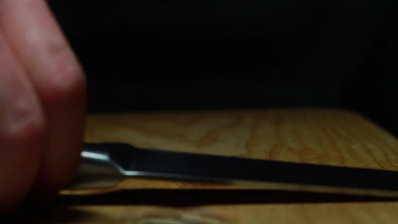 Free Video Stock Slicing A Tomato Over A Chopping Board Live Wallpaper