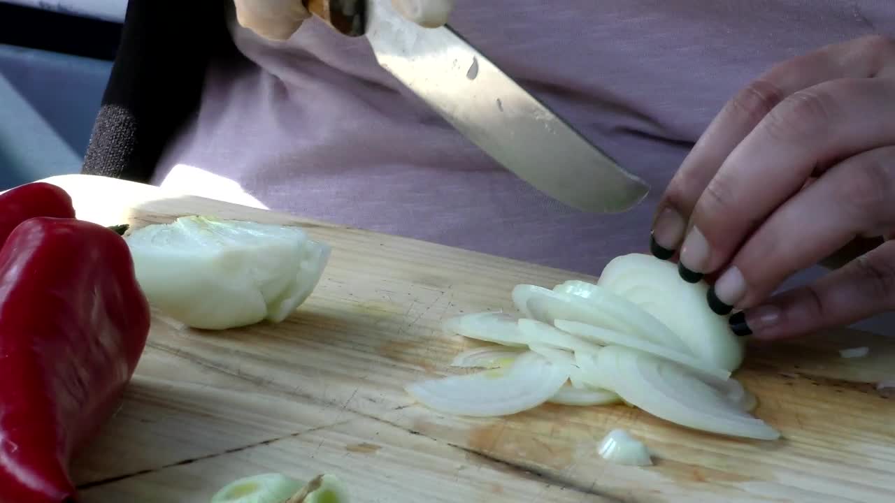 Free Video Stock Slicing An Onion On A Board Live Wallpaper