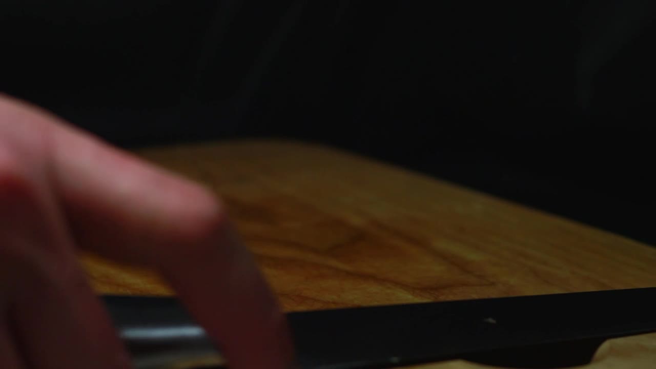 Free Video Stock Slicing An Orange On A Cut Board Live Wallpaper