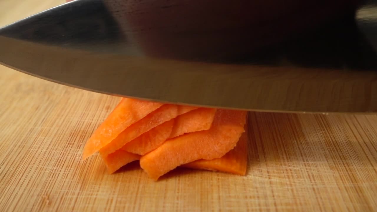 Free Video Stock Slicing Carrot On A Board Live Wallpaper