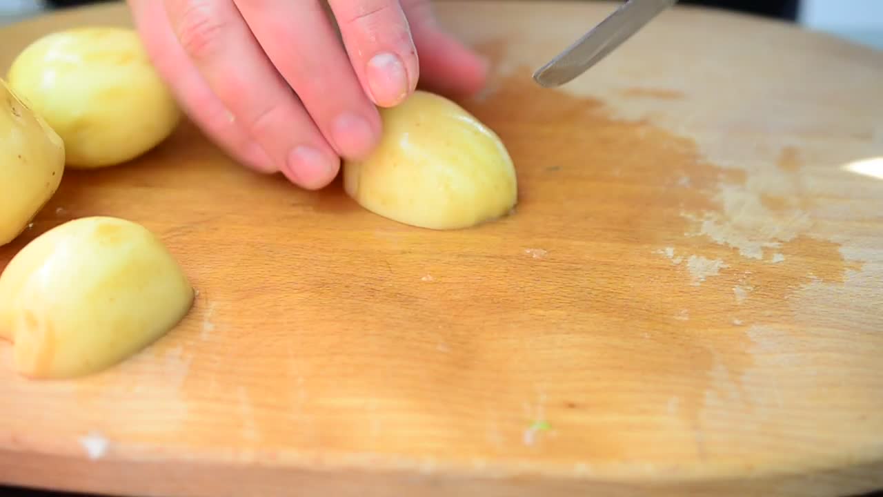 Free Video Stock Slicing Raw Potatoes On A Table Live Wallpaper