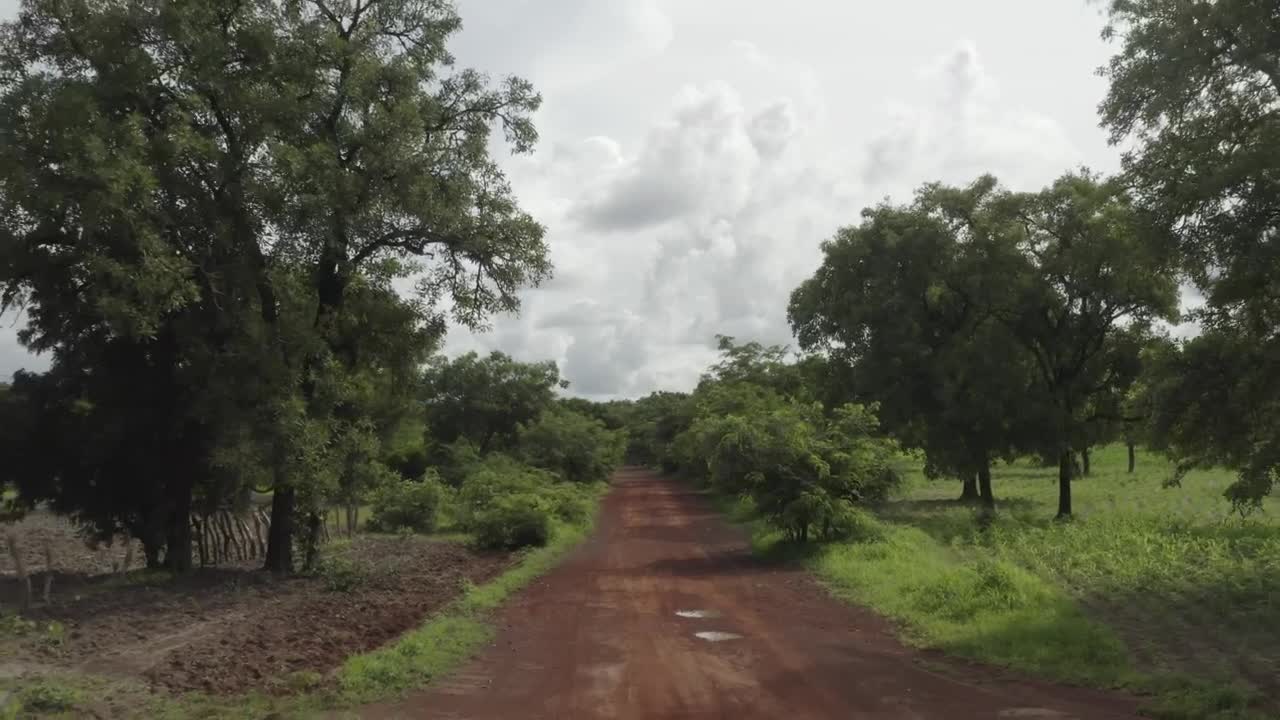 Free Video Stock Small Bike Travelling Down A Muddy Road Live Wallpaper