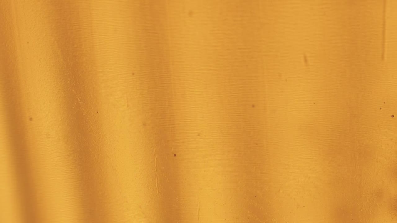 Free Video Stock Small Bubbles In A Liquid On A Yellow Background Live Wallpaper