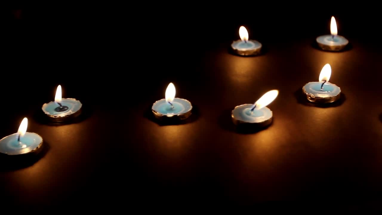 Free Video Stock Small Lit Candles In The Dark Live Wallpaper
