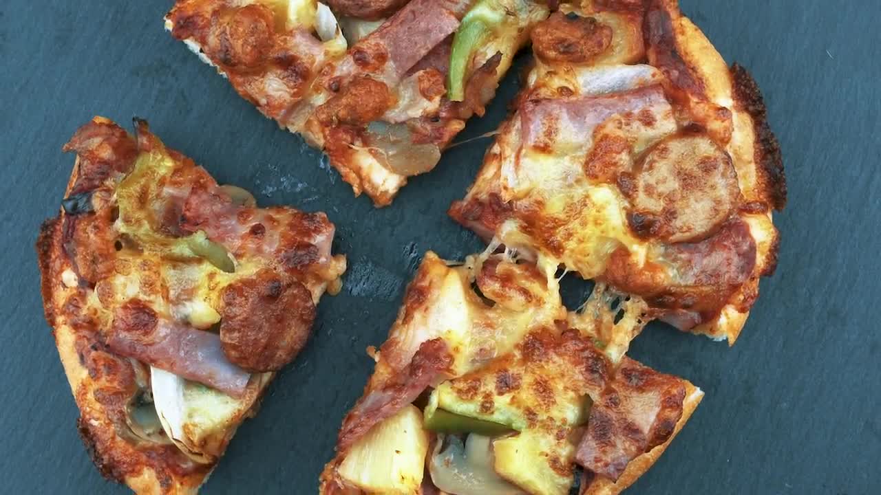 Free Video Stock Small Pizza Cut Into Four Live Wallpaper