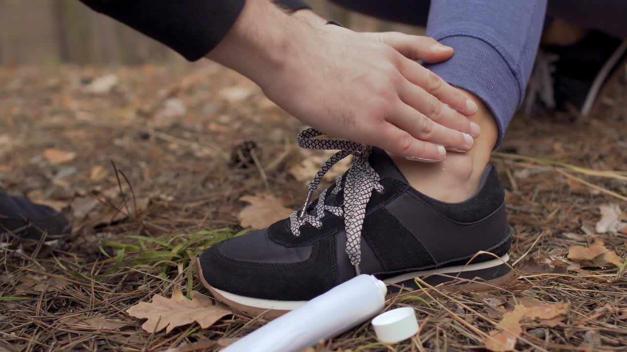 Free Video Stock Smearing Ointment On A Persons Ankle Live Wallpaper