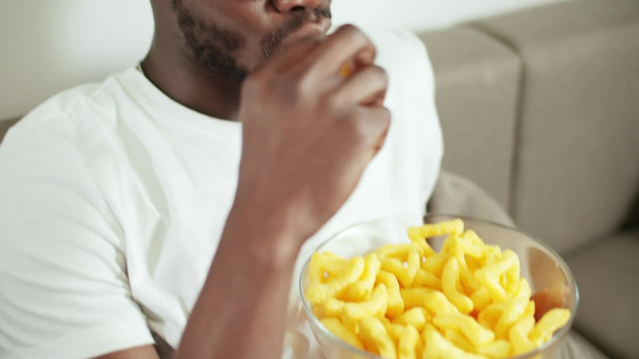 Free Video Stock Smiling Man Watches Movie And Eats Snacks Live Wallpaper