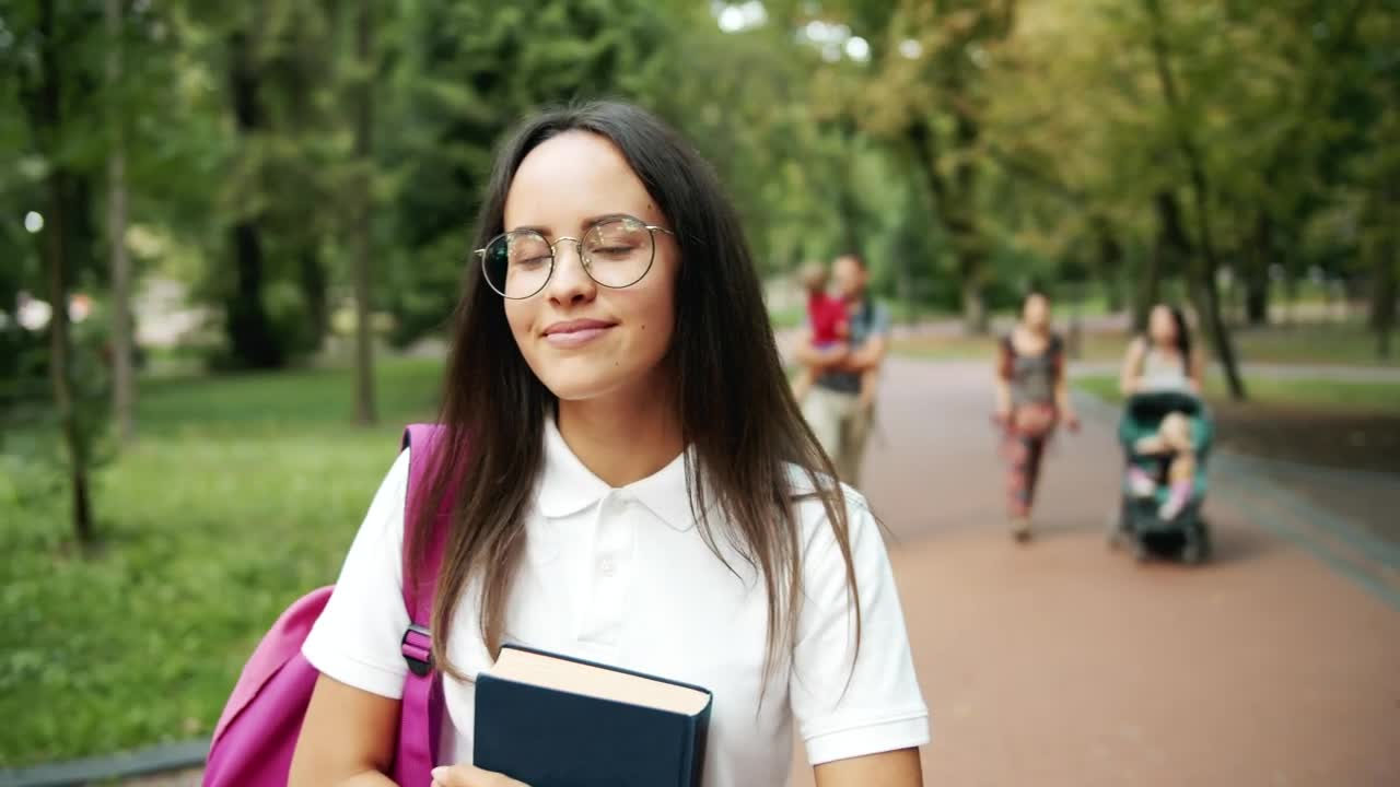 Free Video Stock Smiling Student Inspired By Nature In Park Live Wallpaper