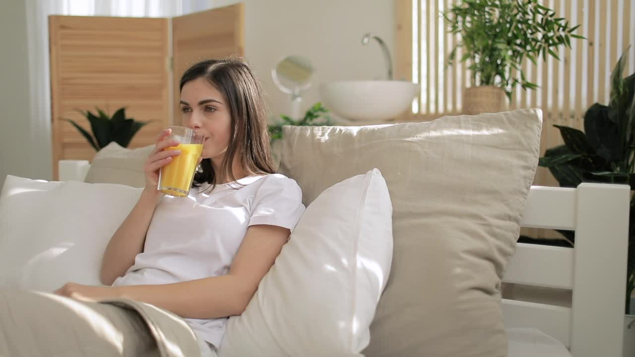 Free Video Stock Smiling Woman Drinking Orange Juice Live Wallpaper