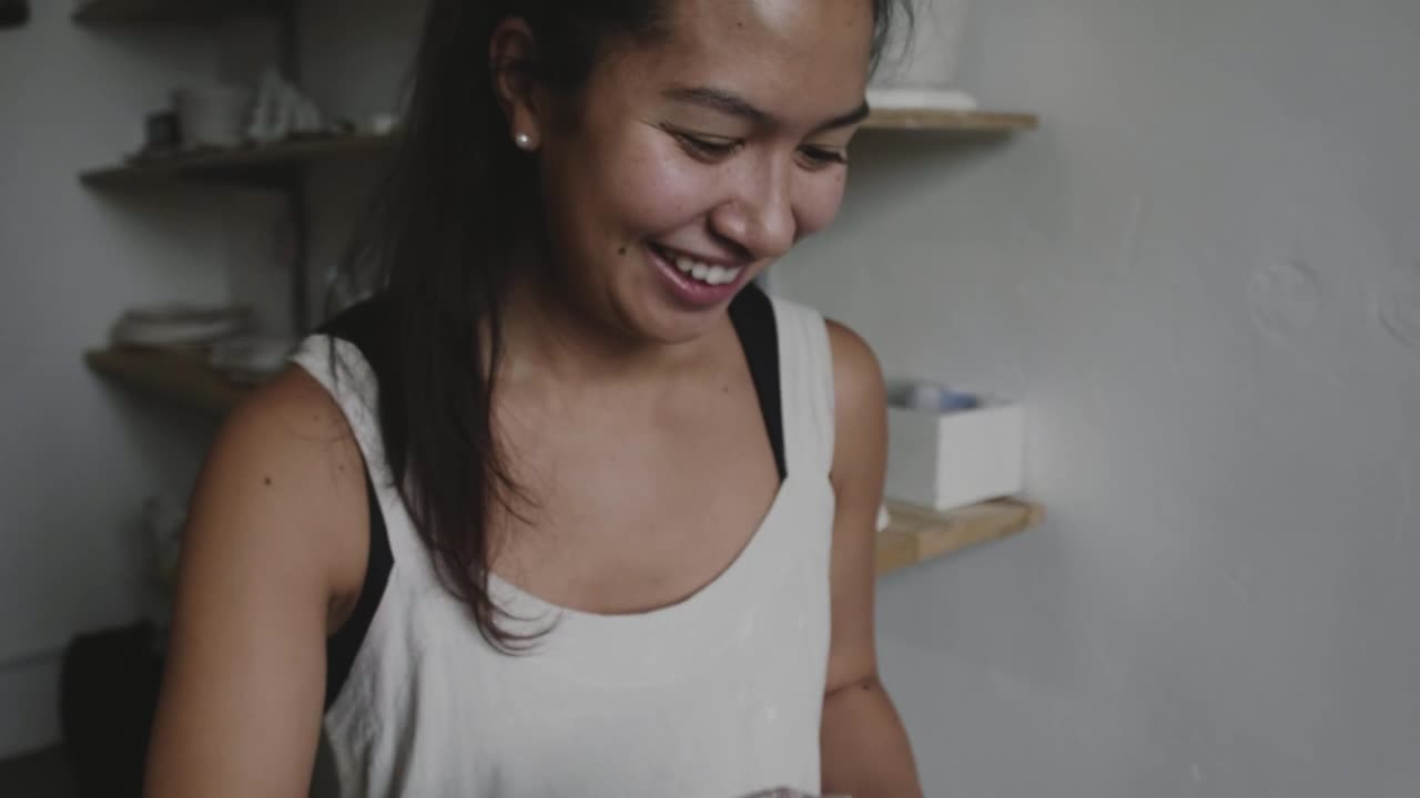 Free Video Stock Smiling Woman With Pottery Object Live Wallpaper