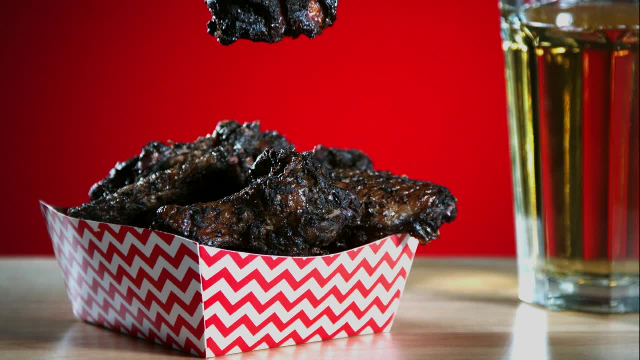 Free Video Stock Smoked Chicken Wings Falling Into The Table Live Wallpaper