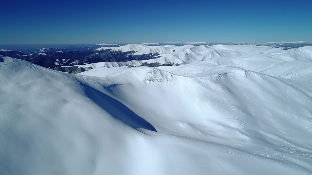 Free Video Stock Smooth Texture Of Snow Over Mountains Live Wallpaper