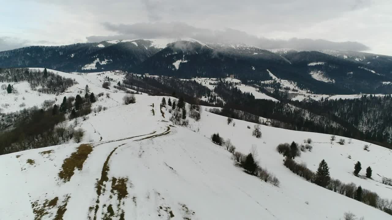 Free Video Stock Snow Covered Hill In A Mountain Range Aerial Shot Live Wallpaper