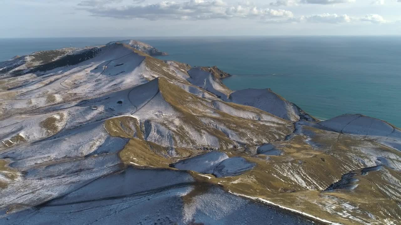 Free Video Stock Snow Topped Hills By The Ocean Live Wallpaper