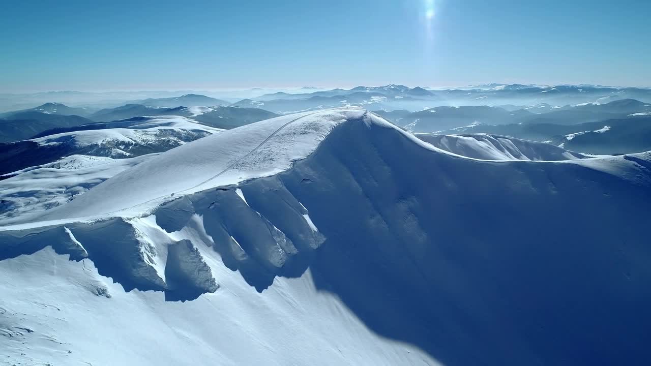 Free Video Stock Snowy Hill In A Mountain Range Live Wallpaper