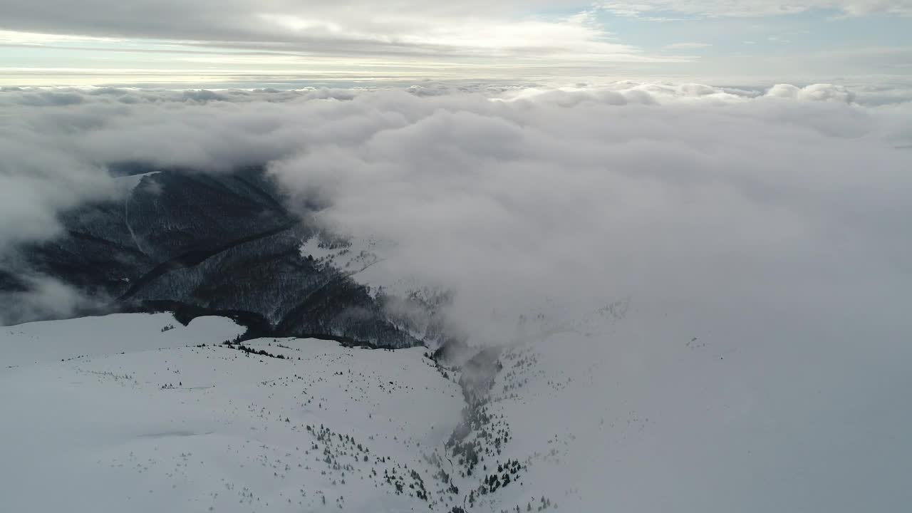 Free Video Stock Snowy Relief Covered By Clouds From Above Live Wallpaper