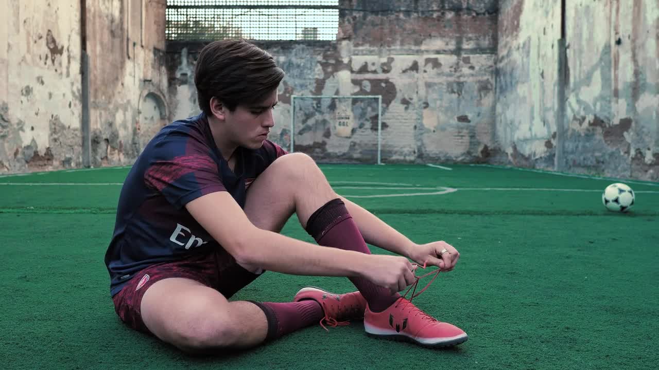 Free Video Stock Soccer Player Ties His Laces Live Wallpaper