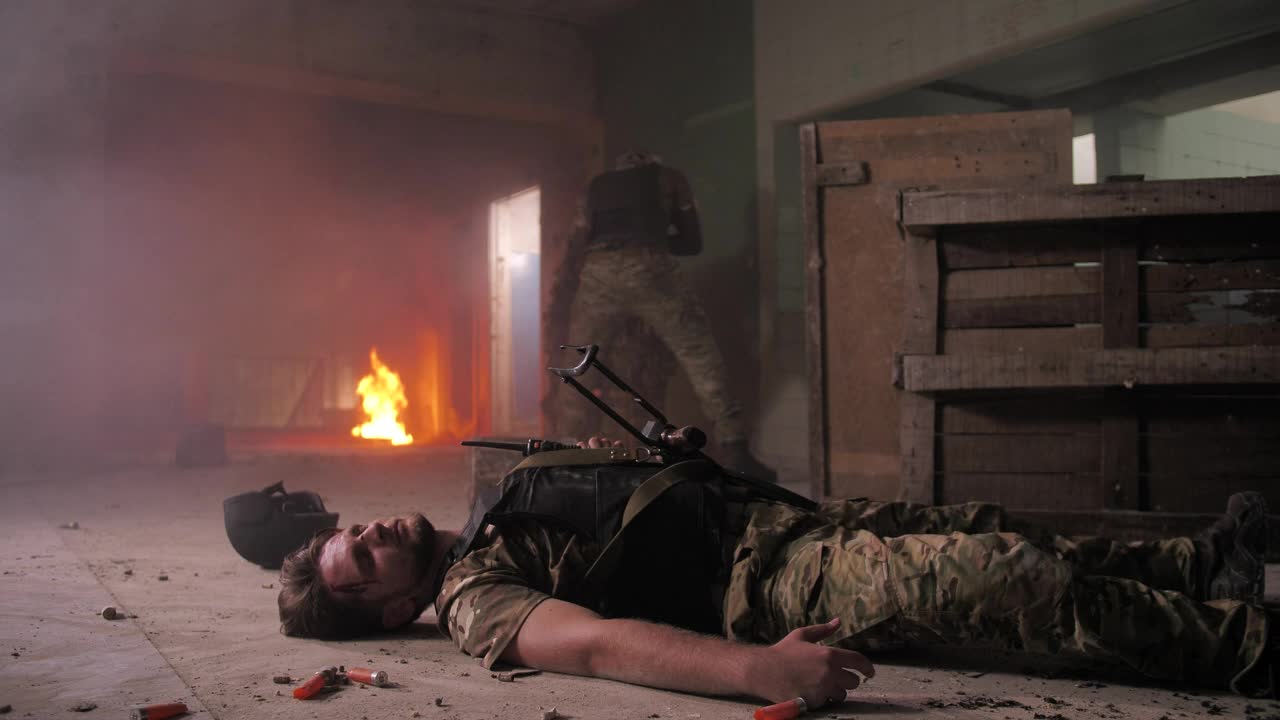 Free Video Stock Soldier Moving In To Help A Downed Man Live Wallpaper