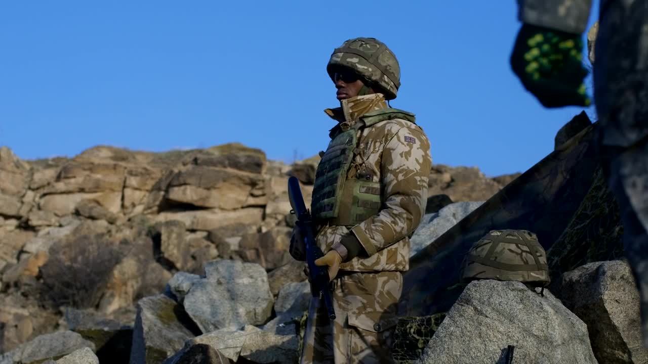 Free Video Stock Soldier Standing In The Countryside Live Wallpaper