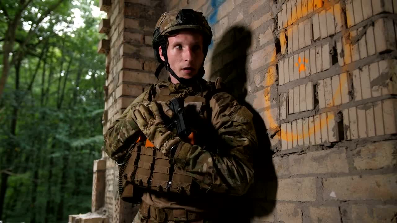 Free Video Stock Soldier With A Gun In Hand Advancing Cautiously Live Wallpaper