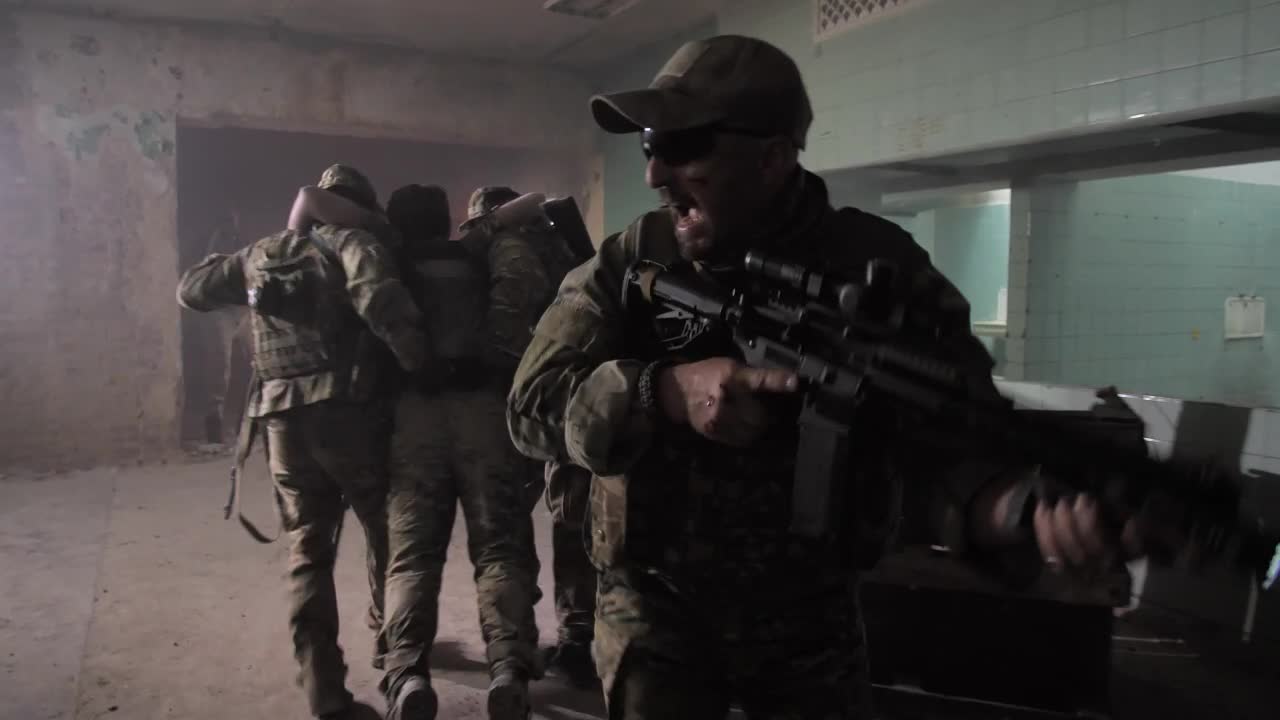 Free Video Stock Soldiers Carrying A Wounded Man Through A Building Live Wallpaper