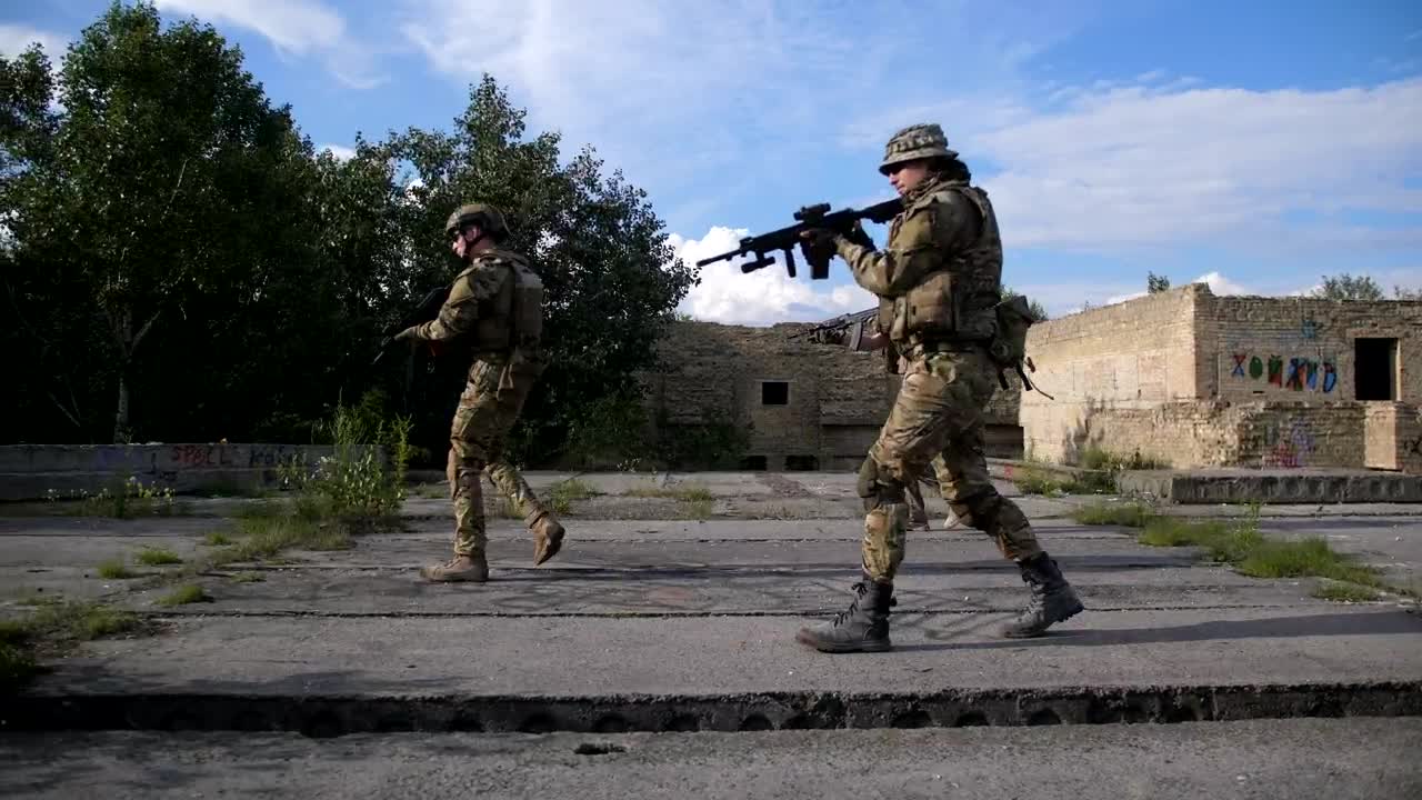 Free Video Stock Soldiers Clearing An Urban Ruin Live Wallpaper