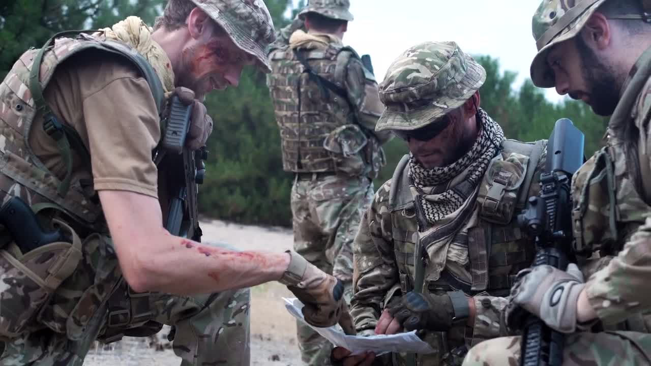 Free Video Stock Soldiers Discussing Where To Go On The Map Live Wallpaper