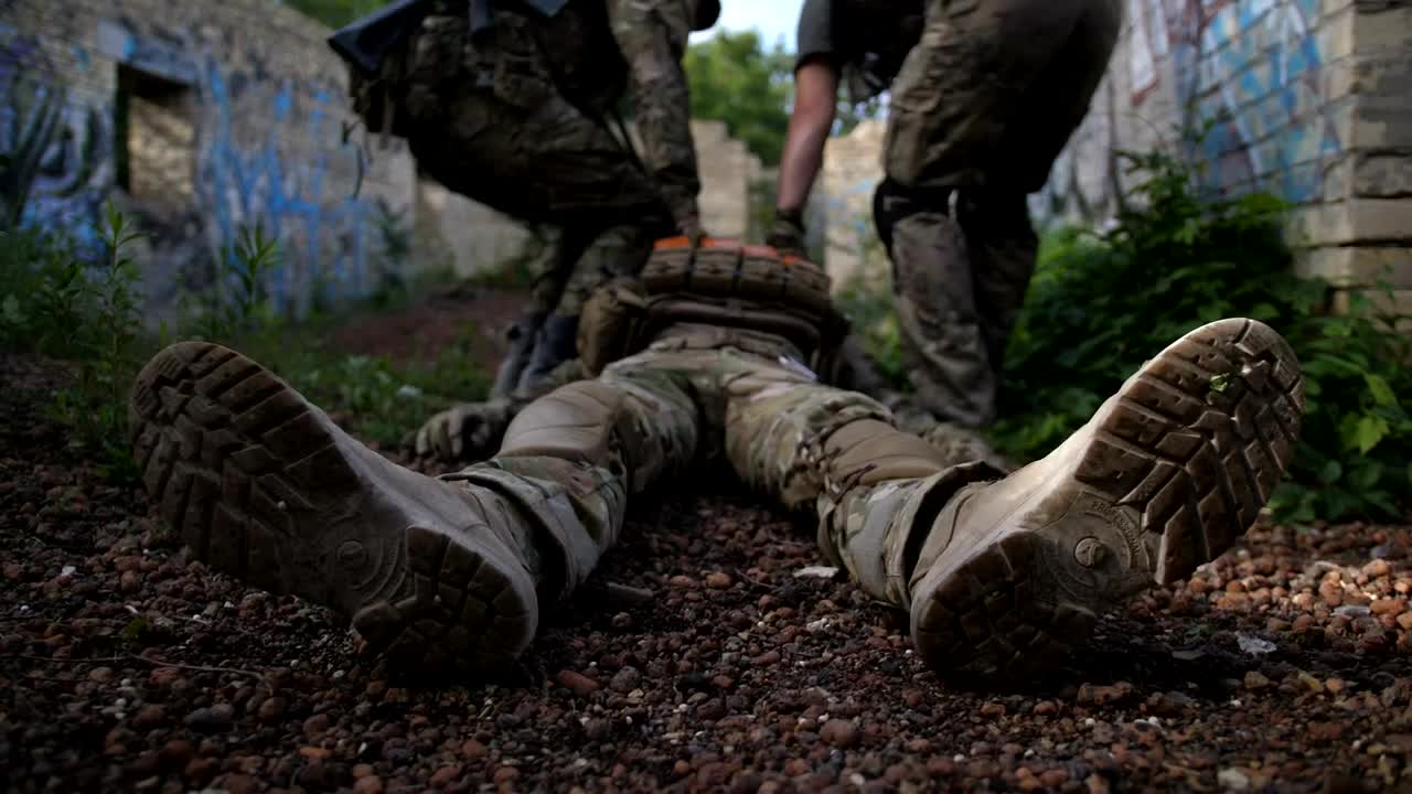 Free Video Stock Soldiers Drag A Wounded Man Live Wallpaper
