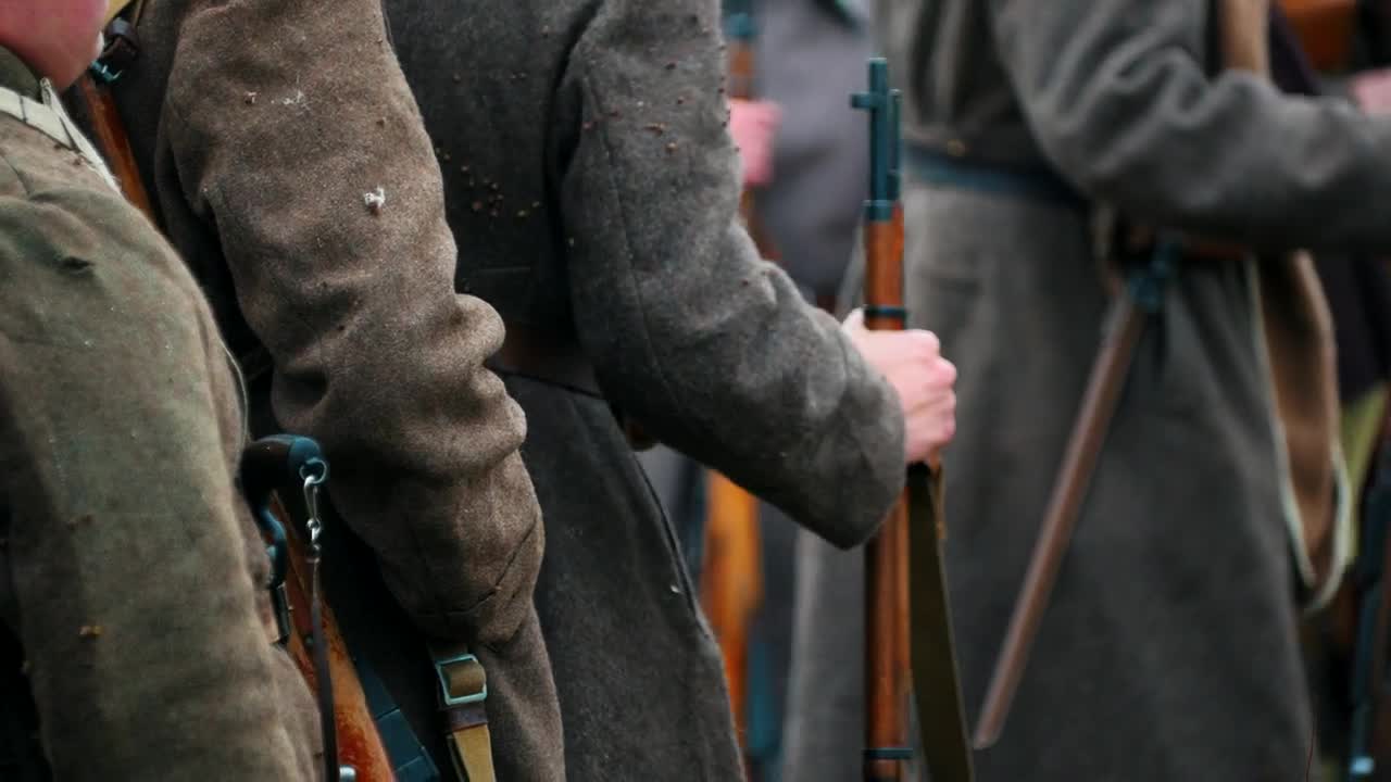 Free Video Stock Soldiers In Coats Standing In A Row Holding Guns Live Wallpaper
