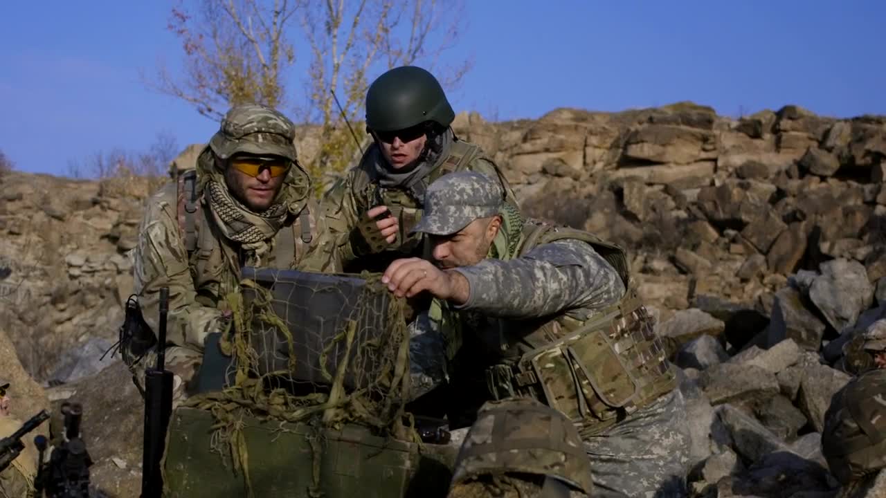 Free Video Stock Soldiers Looking At Computer Outdoors Live Wallpaper
