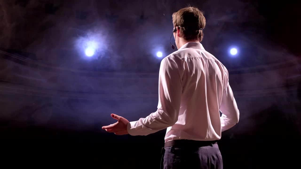 Free Video Stock Speaker Gives A Talk In An Auditorium Live Wallpaper