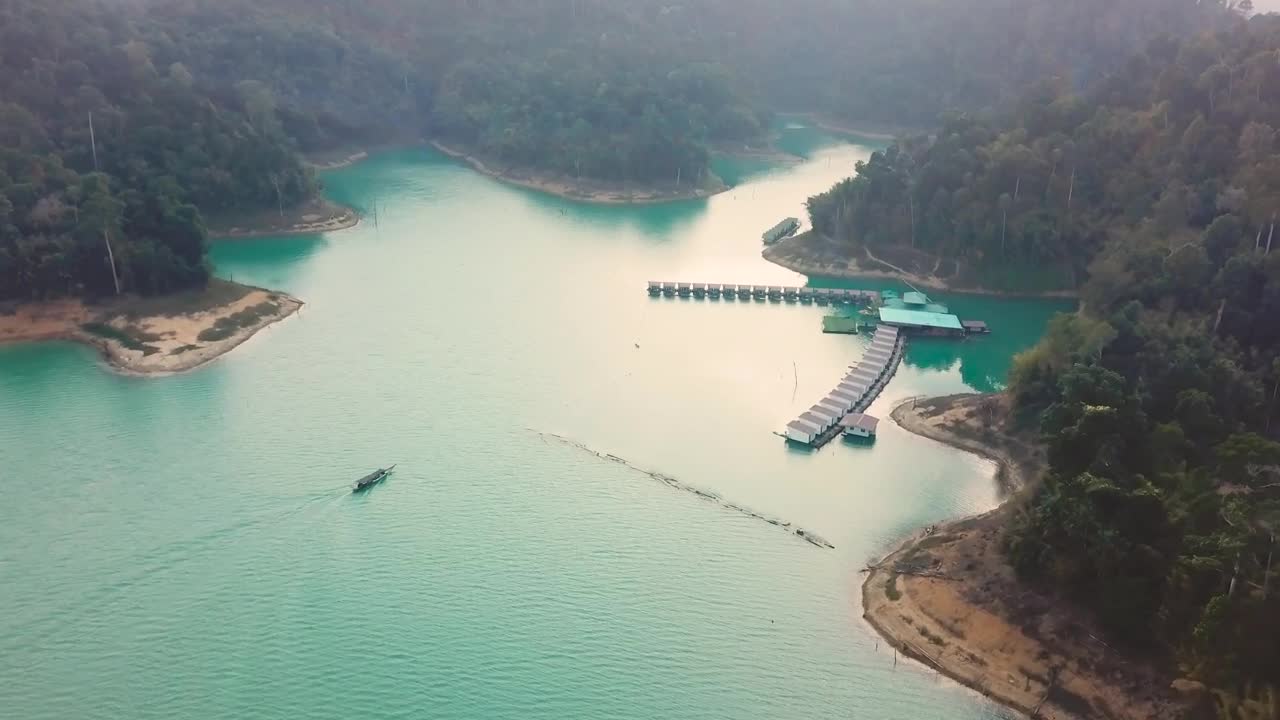 Free Video Stock Speedboat Returning To A Beautiful Bay Seen From The Sky Live Wallpaper