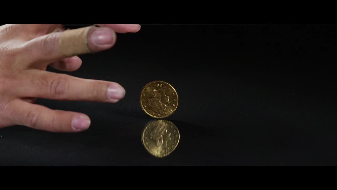 Free Video Stock Spinning Coin On A Reflective Surface Live Wallpaper