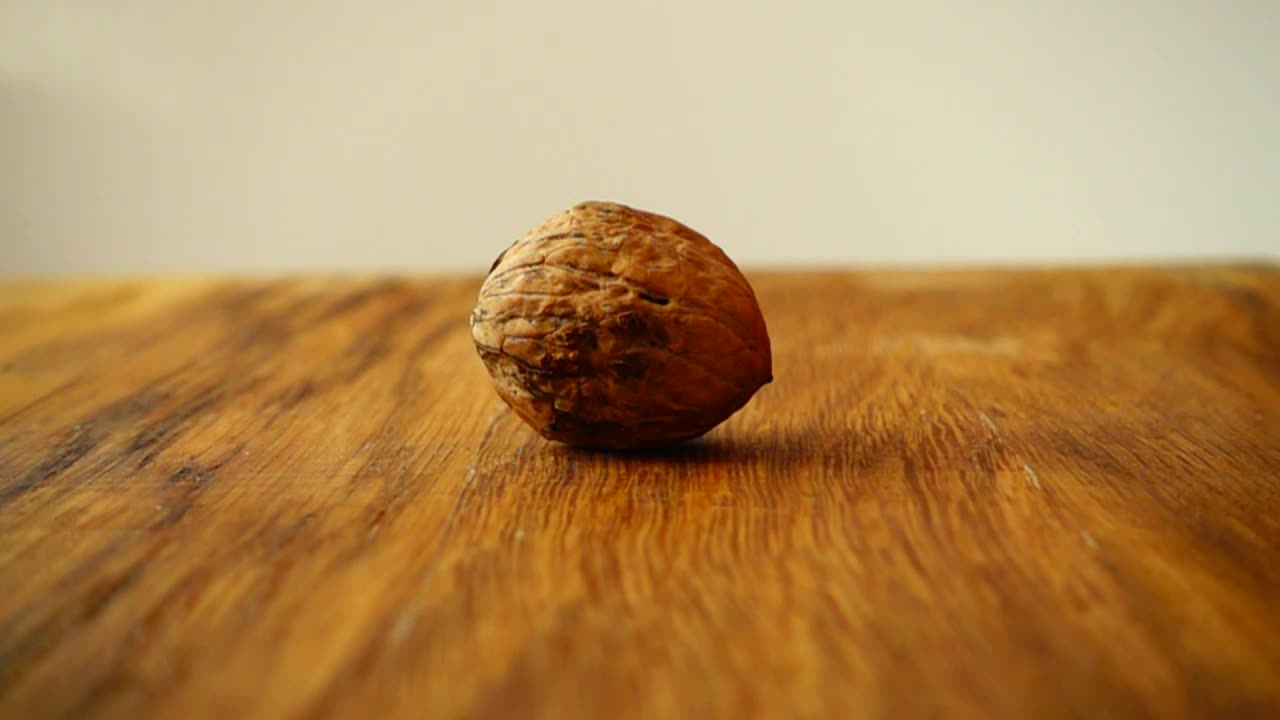 Free Video Stock Splitting A Walnut With A Hammer Live Wallpaper
