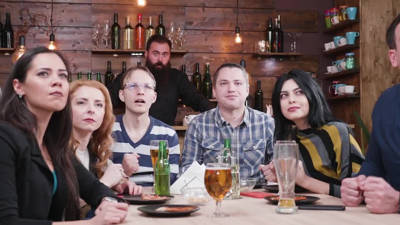 Free Video Stock Sports Fans Watching A Game In A Bar Live Wallpaper