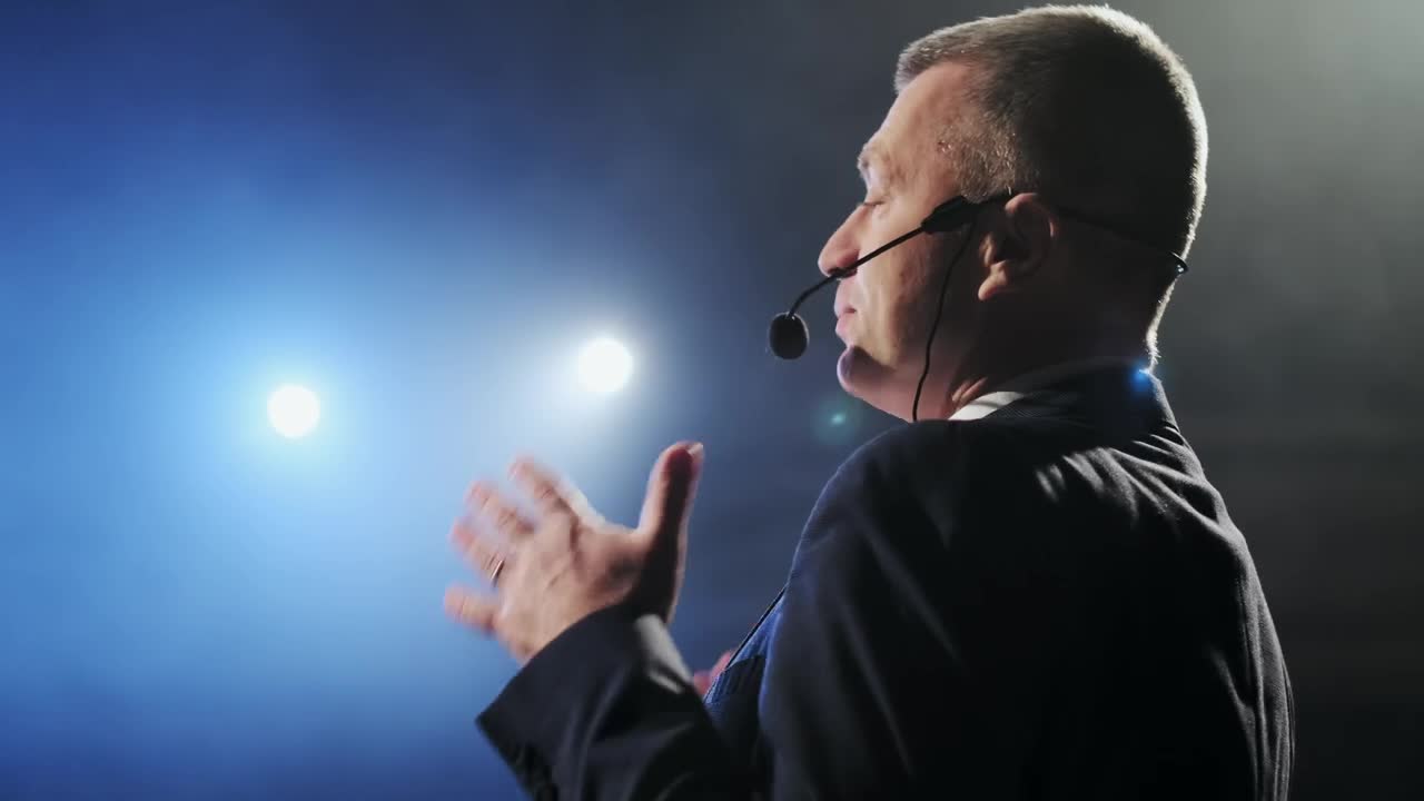 Free Video Stock Spotlights Illuminating A Successful Speaker On Stage Live Wallpaper
