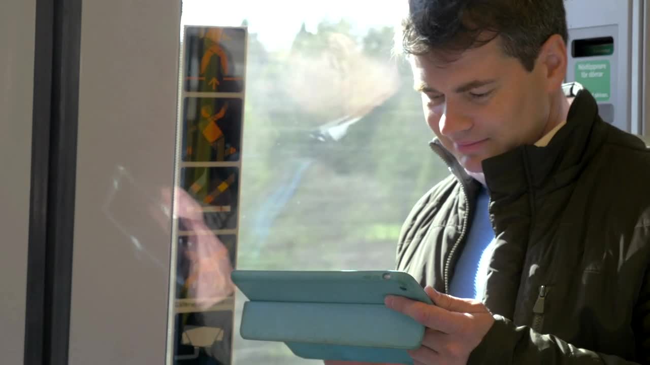 Free Video Stock Standing On A Train With A Tablet Live Wallpaper