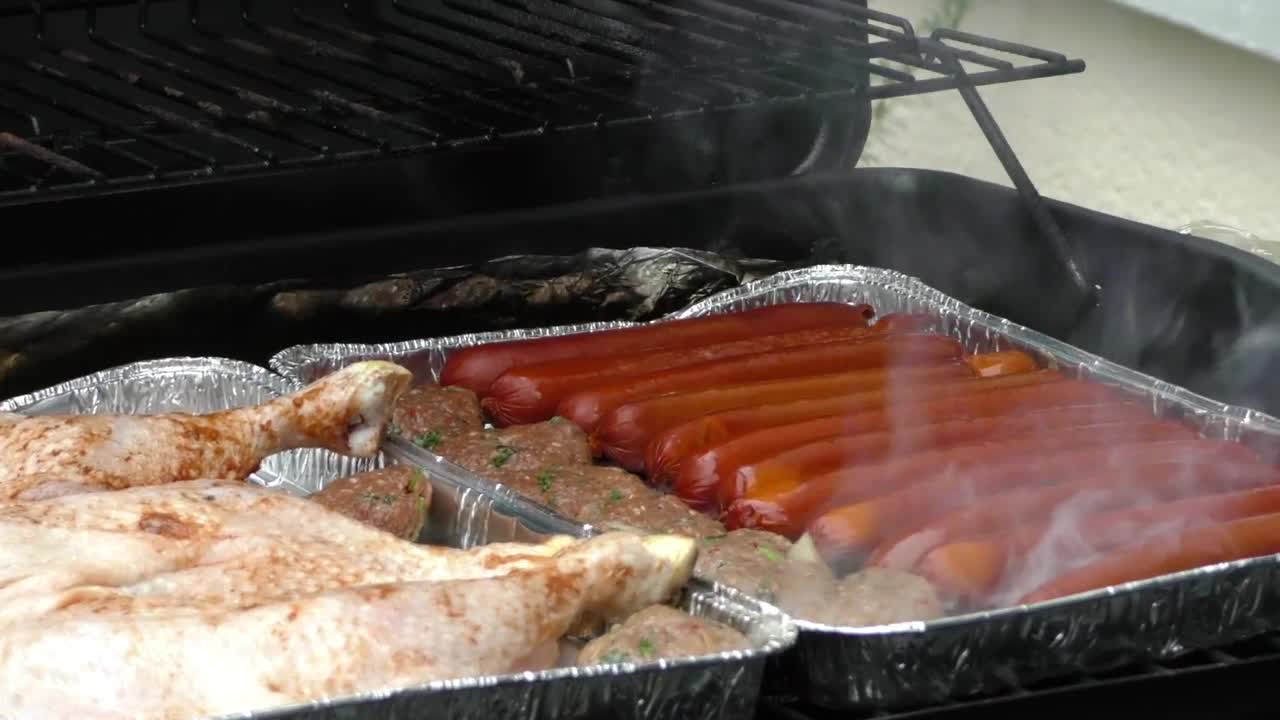 Free Video Stock Starting The Roast With Charcoal Live Wallpaper