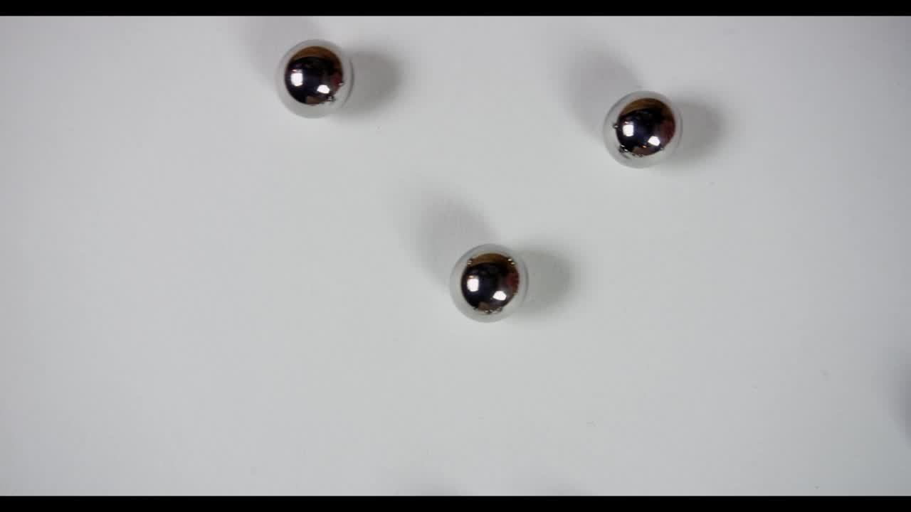 Free Video Stock Steel Pellets Rolling On White Surface Live Wallpaper