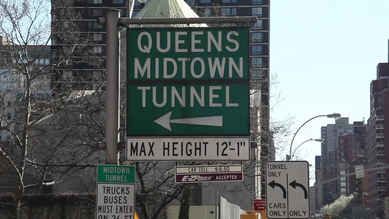Free Video Stock Street Signs Leading To A Tunnel Live Wallpaper