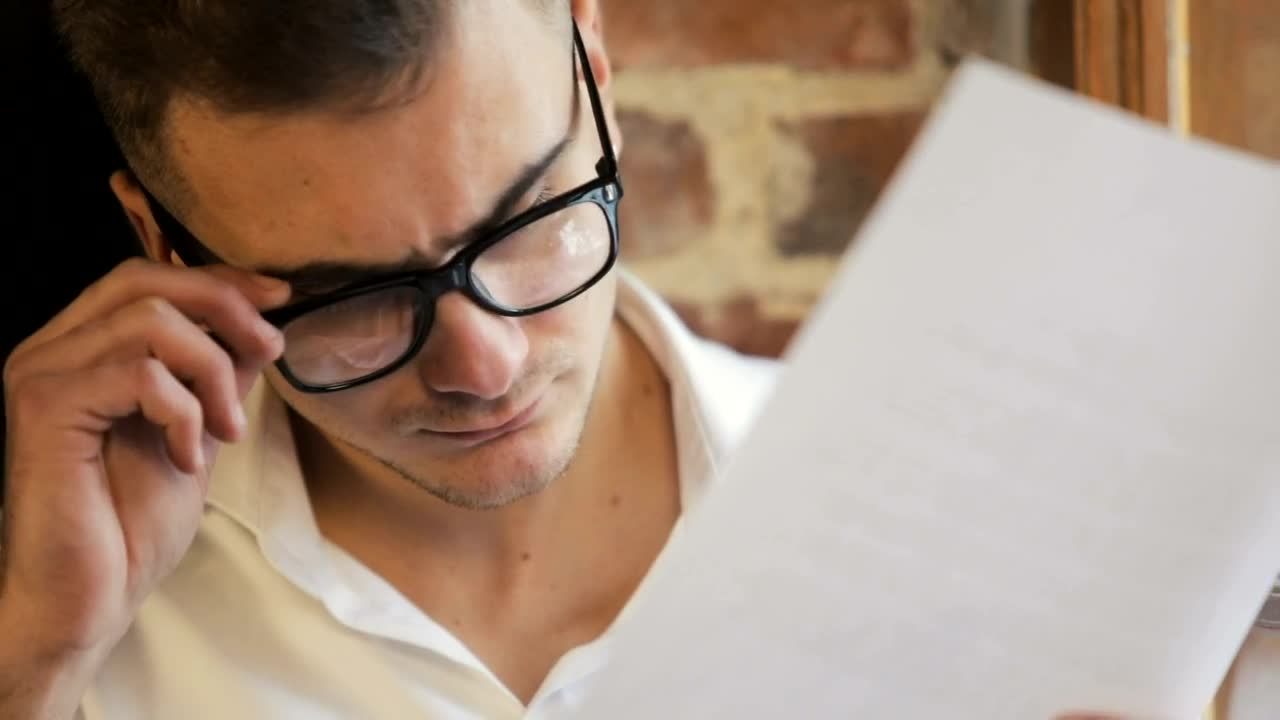 Free Video Stock Stressed Man Removes Glasses And Rubs Forehead Live Wallpaper