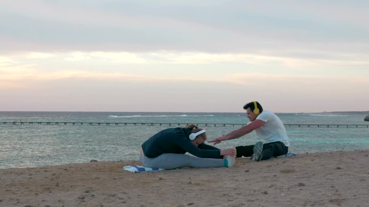 Free Video Stock Stretching Before Going For A Run On The Beach Live Wallpaper