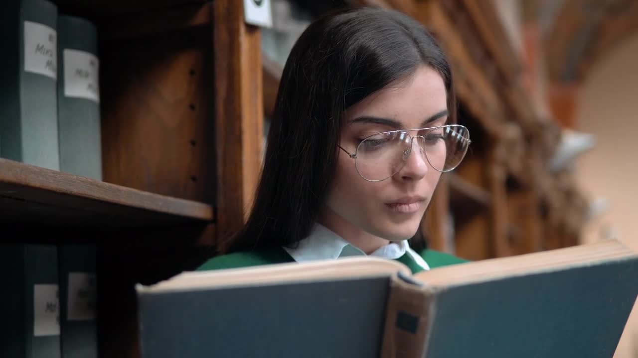 Free Video Stock Student Surprised By Something She Reads In Book Live Wallpaper
