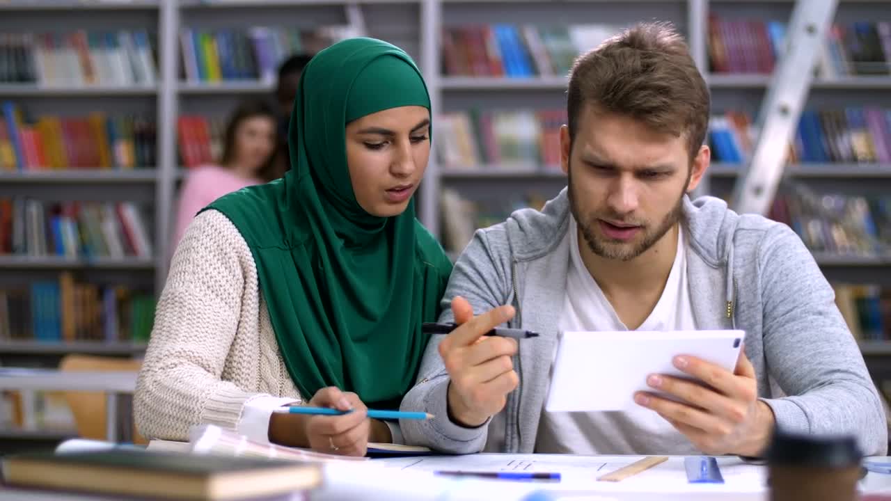 Free Video Stock Students Researching Using A Tablet At Library Live Wallpaper