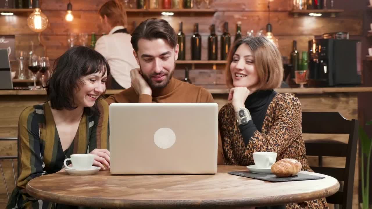 Free Video Stock Stylish Friends Share Ideas At Hip Cafe With Laptop Live Wallpaper