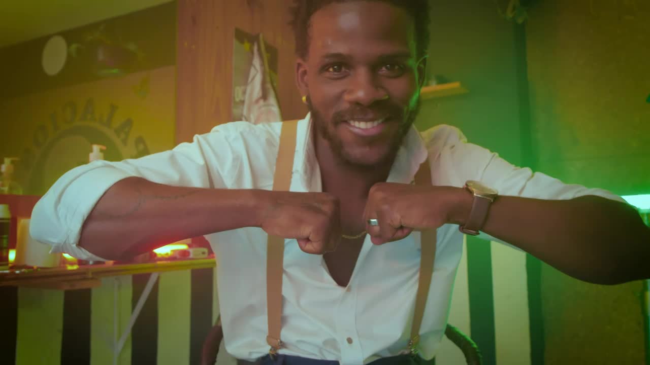 Free Video Stock Stylish Man Dancing In Front Of The Camera In A Live Wallpaper