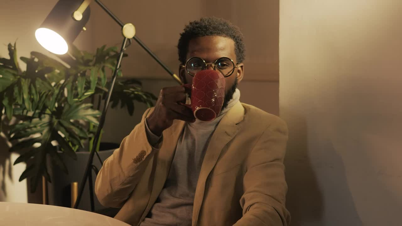 Free Video Stock Stylish Man Drinking A Cup Of Coffee Live Wallpaper