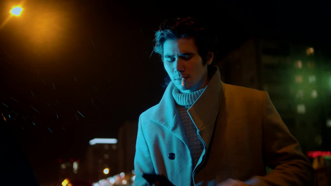 Free Video Stock Stylish Man Smoking A Cigarette And Texting A Message Live Wallpaper